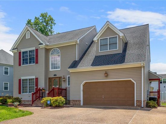 Two-story gray home with a two-car garage in Newport News, VA
