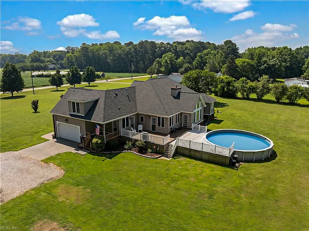 Aerial view of a home on open land